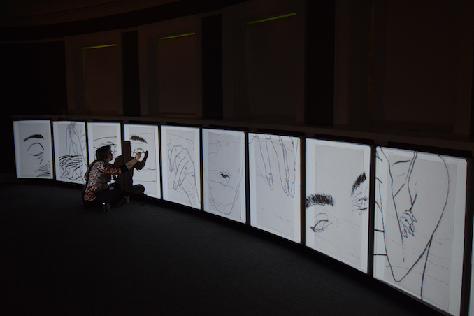 Shot of myself drawing a figure during my piece "Syncopate" during the Spectral Illuminations event during Beakerhead in 2018. It was at Memorial library, this piece consisted of drawing, animation, projection and performance. 