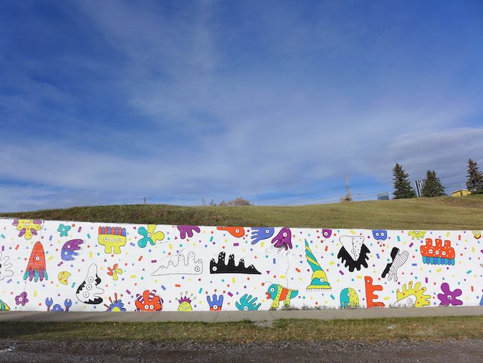 This is a section of the 74 metre community mural I helped to crowdfund and paint with the community of Ramsay on 9 Street SE.