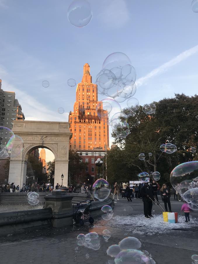 What New York's parks lack in quiet nature time, they make up for in wild social life at all hours of the day and evening. This photo of Washington Square Park at Sundown shows only the man blowing enormous bubbles with a fishing net on sticks. Around him, though, are skaters filming each other doing tricks, artists selling their work, hot dog stands, ice cream trucks, the cart selling political buttons, chess games, dogs playing, a wedding being photographed, and a dude playing a grand piano on wheels in the middle of a walking path. 