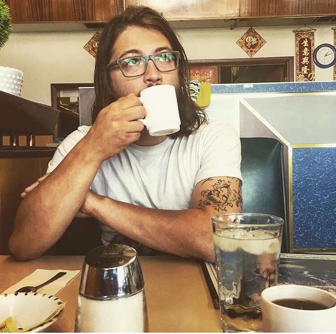 This is a photo of my amazing partner Alex Los. No, we do not get confused having the same name, but you will. This was taken at a run down diner in Lamont AB after a weekend at Elk Island. He is really kind and smart.