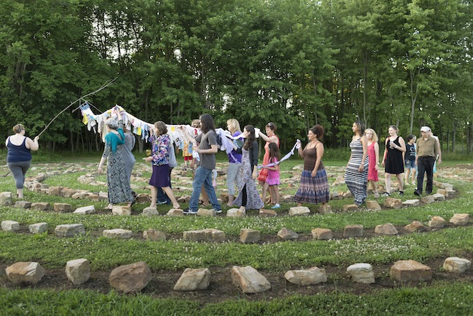 Releasing of the Dreams community performance ritual in the stone labyrinth at Mandala Gardens in Illinois