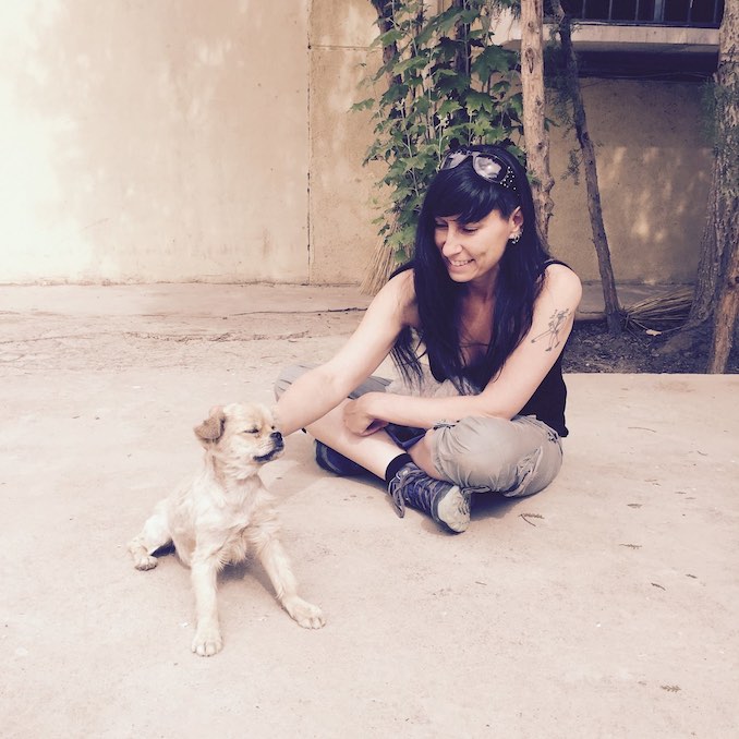 Enjoying the company of a street pup during my travels through China.