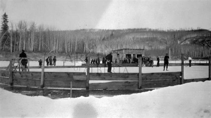 1931 - A11989 - People playing on an outdoor skating rink in Fort McMurray.