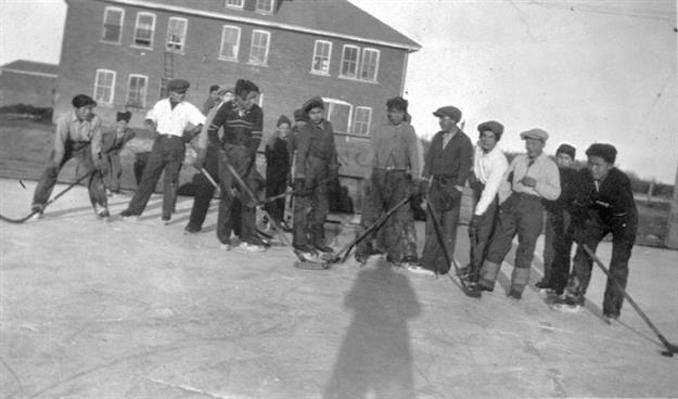 1936 - A13454 - Group of students playing outside Indian Residential School, Edmonton.