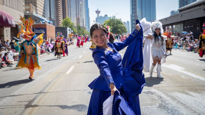 Carla Diaz performs La Marinera Norteña with Raíces del Peru in the Calgary Stampede Parade on July 6, 2018. © J. Ashley Nixon