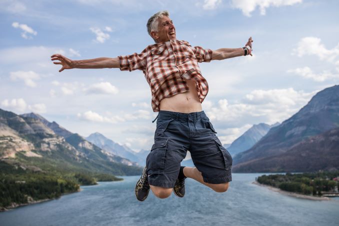Peter Morris jumps over Waterton Lake, August 6, 2018. © J. Ashley Nixon