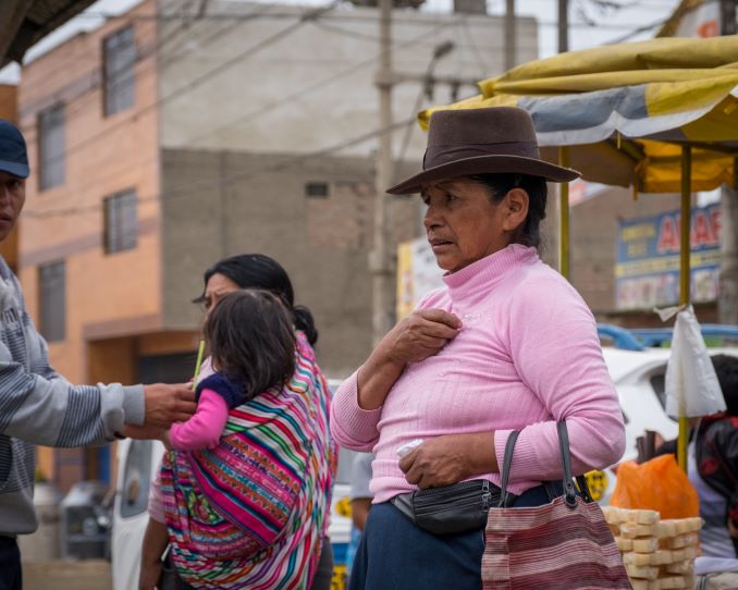 Shoppers buy food at an open market in Manchay, Lima, Peru, December 24, 2015. Part of a book published in 2018 about developing communities in Peru. © J. Ashley Nixon