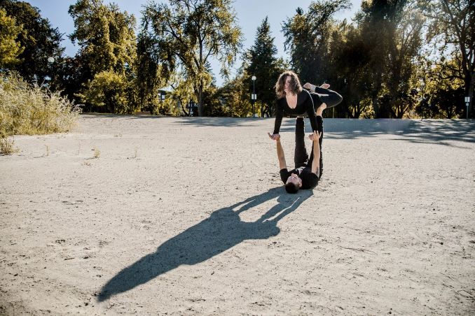 Andrew Cooper practicing acrobatics at the beach. (Photo by Emily-May Photography)