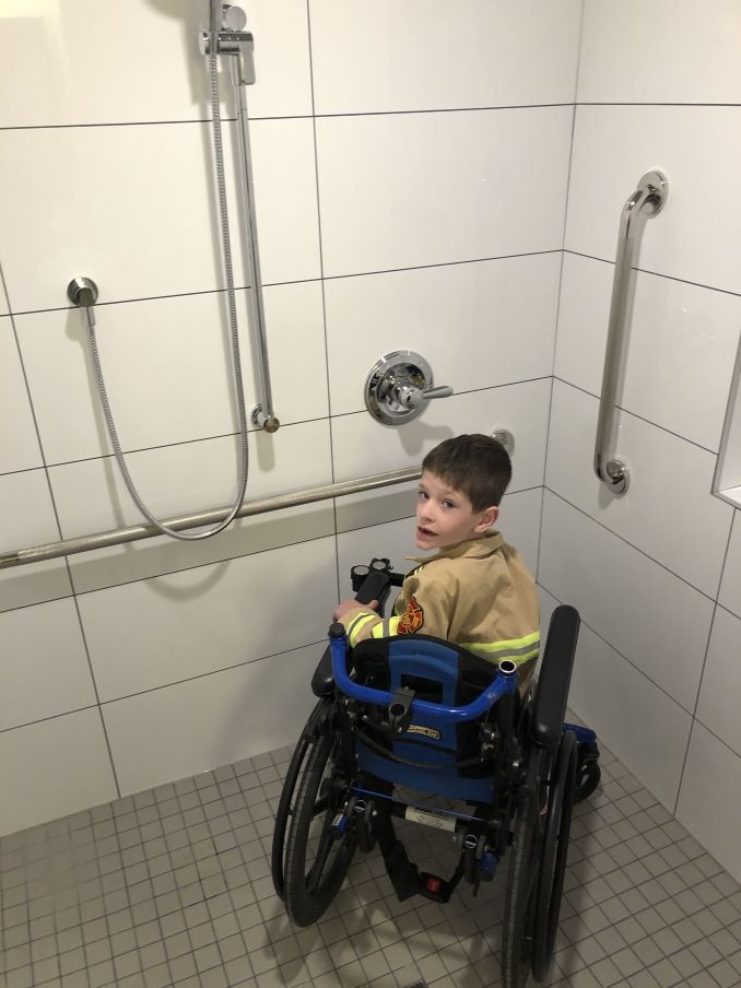 5yr old Jaydon in his new bathroom provided by ARK