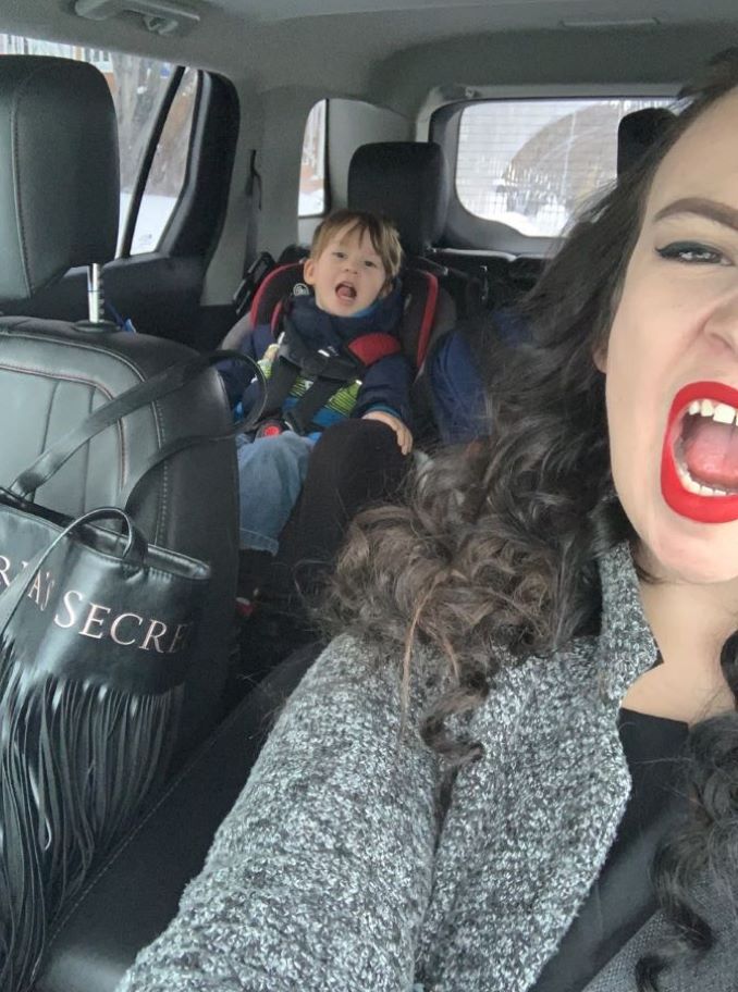 Mom (Chantel Dixon) and son (Beau Rollison) being goofy in mom’s car.-min