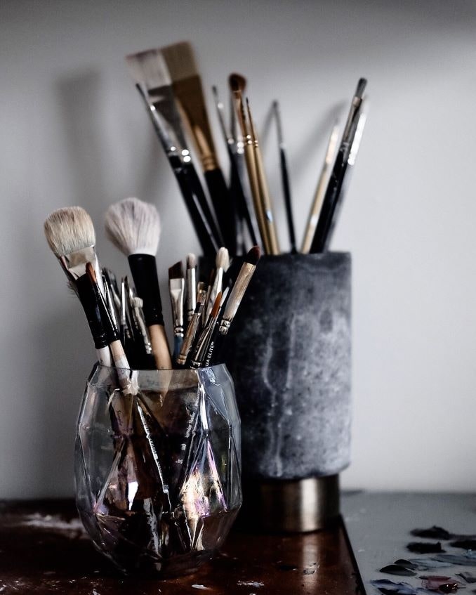 My paintbrushes, some of my most prized possessions. I like to re-use empty candle jars to hold them.