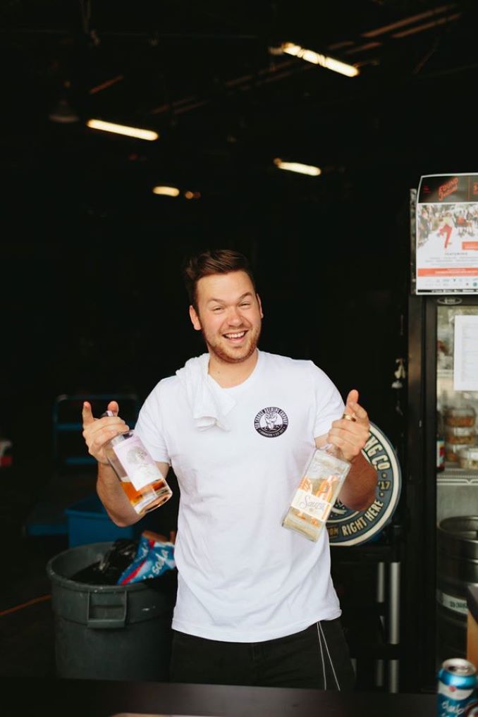 Griffin running the bar at Common Ground Society’s Found Festival in Edmonton