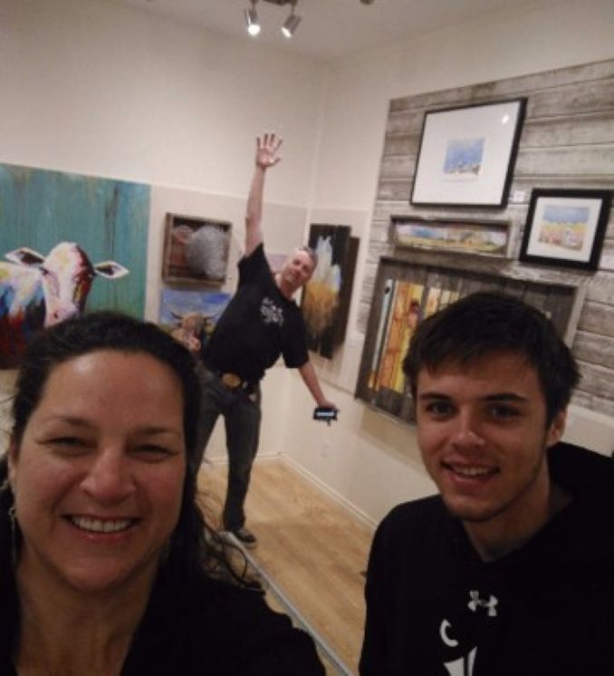 Here I am with my Love, Doug Symington, far off in the distance and our nephew Symon beside me. We just finished setting up my solo art exhibit, “From The Scarlett Stopping House”