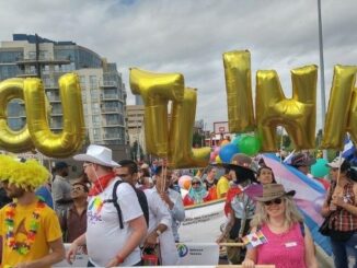 Outlink volunteers marching in the Calgary Pride Parade (2017)
