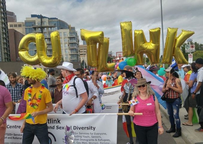 Outlink volunteers marching in the Calgary Pride Parade (2017)