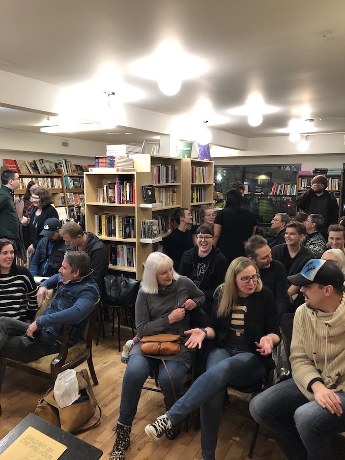 (Audience at flywheel Reading Series) Part of taking an “honest” picture means not being featured. For five years, I hosted flywheel, a monthly reading series held at Pages Bookstore, which hosted authors both national and local, acclaimed and up and coming. There’s a skill to listening that I’m still learning; nowadays I can focus for at least a minute. 