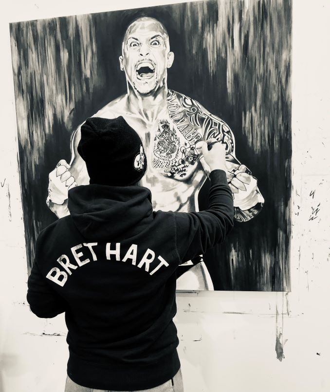 Kim working on an oil painting of Professional Wrestler, Karrion Kross.