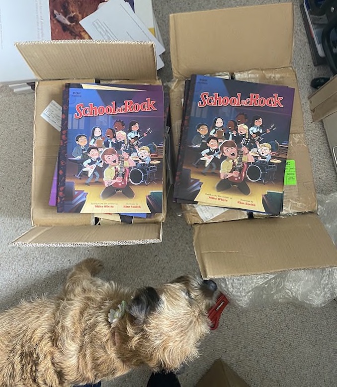 Some of the most exciting days are when I get book mail from the publisher. I just received copies of my next book, School of Rock, in the mail from Quirk Books! It’s always so satisfying to see a book I worked on made into a real tangible thing. My office dog, Whisky, helps me check everything out.