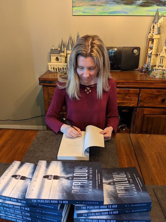 N.L. Blandford - My first batch of books that I gifted to beta readers and family. I used a pen name and I still have not gotten used to a different signature.