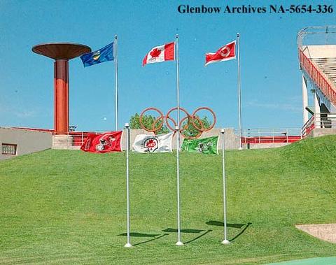 1989 – Flags and Olympic rings at McMahon Stadium, Calgary, Alberta.