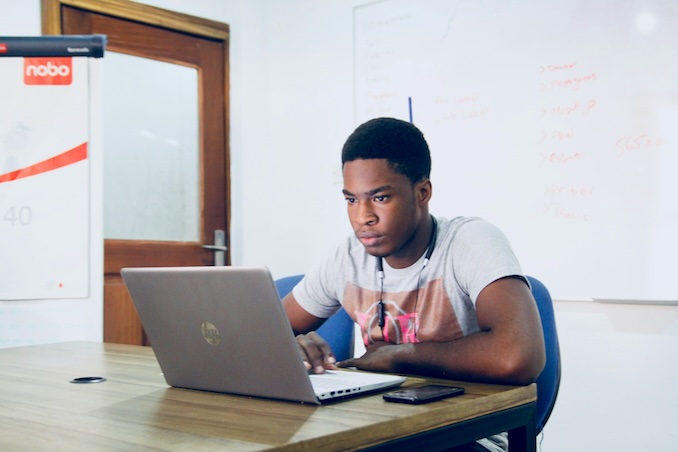 Man playing on his computer.