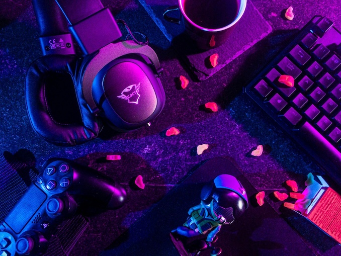 headphones and electronics in purple light