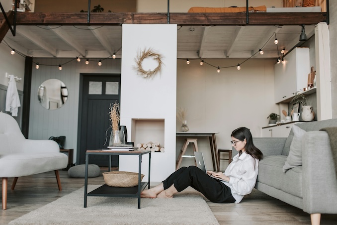 Woman on her laptop on her living room floor