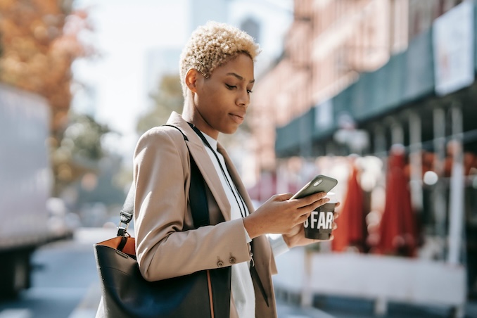 woman using her phone to text
