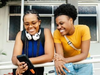 Friends looking at cellphone